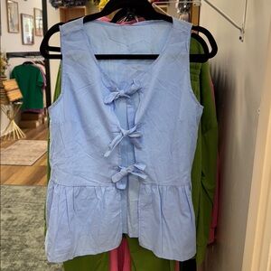 Chic Blue Sleeveless Top with Bow Accents